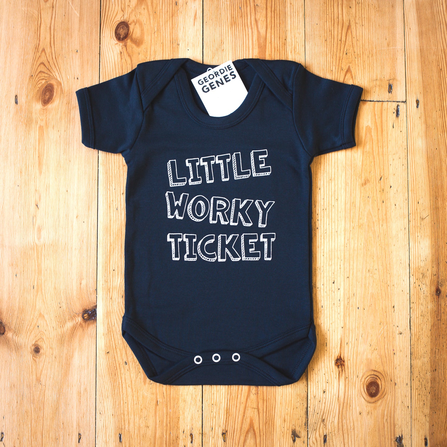 Geordie Genes Little Worky Ticket Baby Vest (Black)